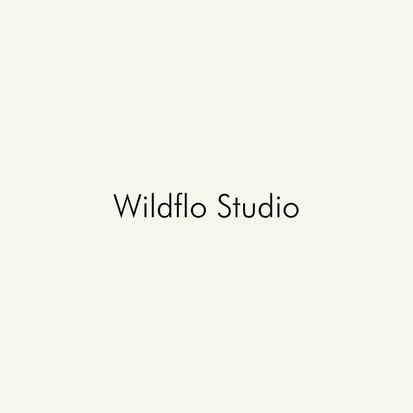 Wildflo Studio black text logo on a minimal light beige background